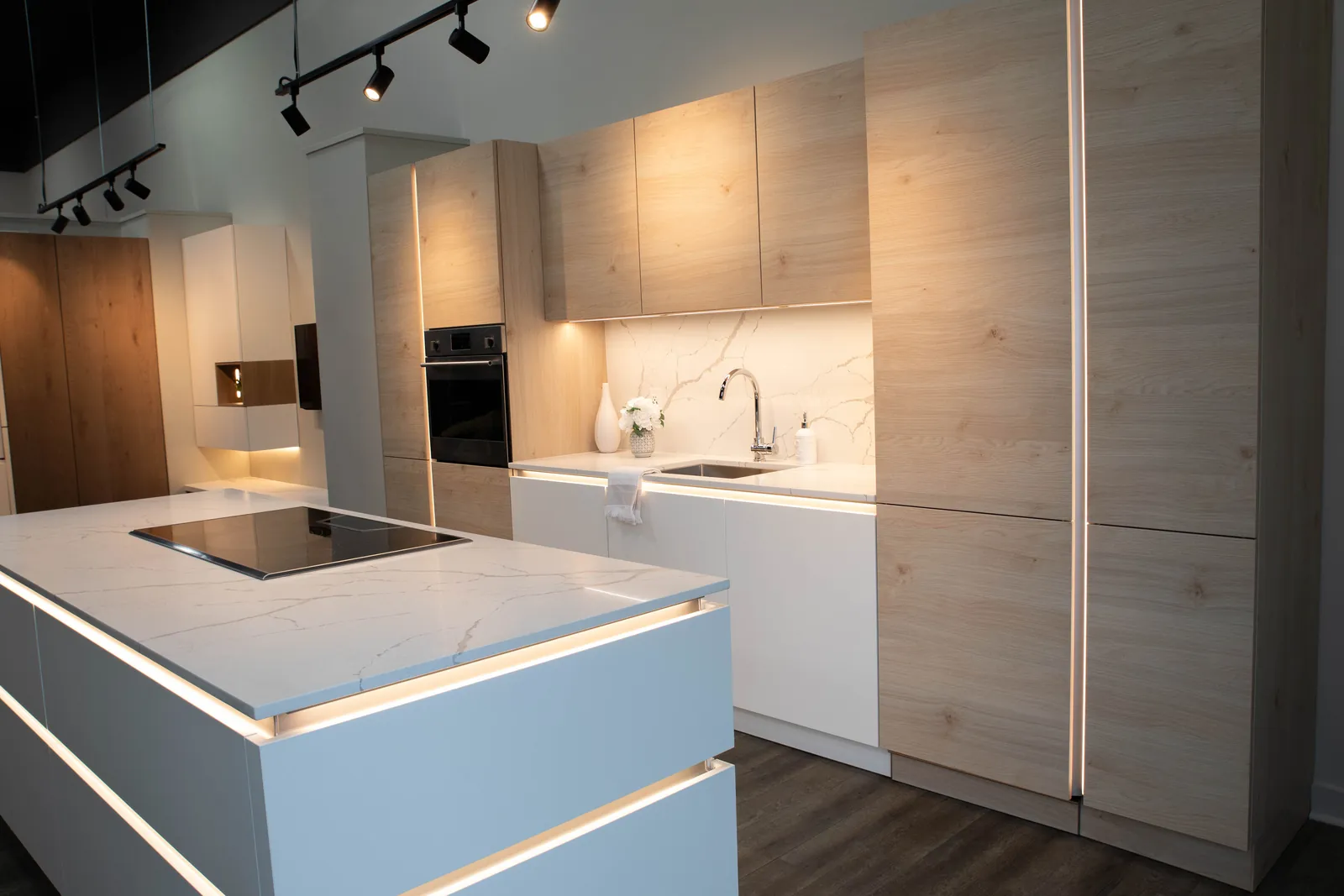 Warm oak and white, with lit handle channels
